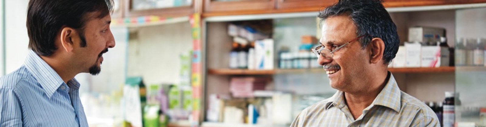 A GSK rep talking with a pharmacist in India