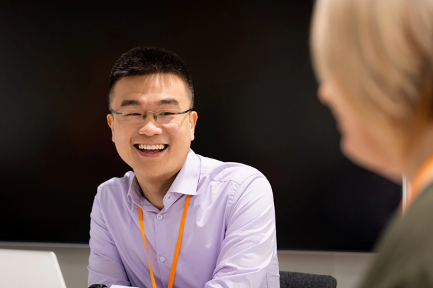 Man in office smiling