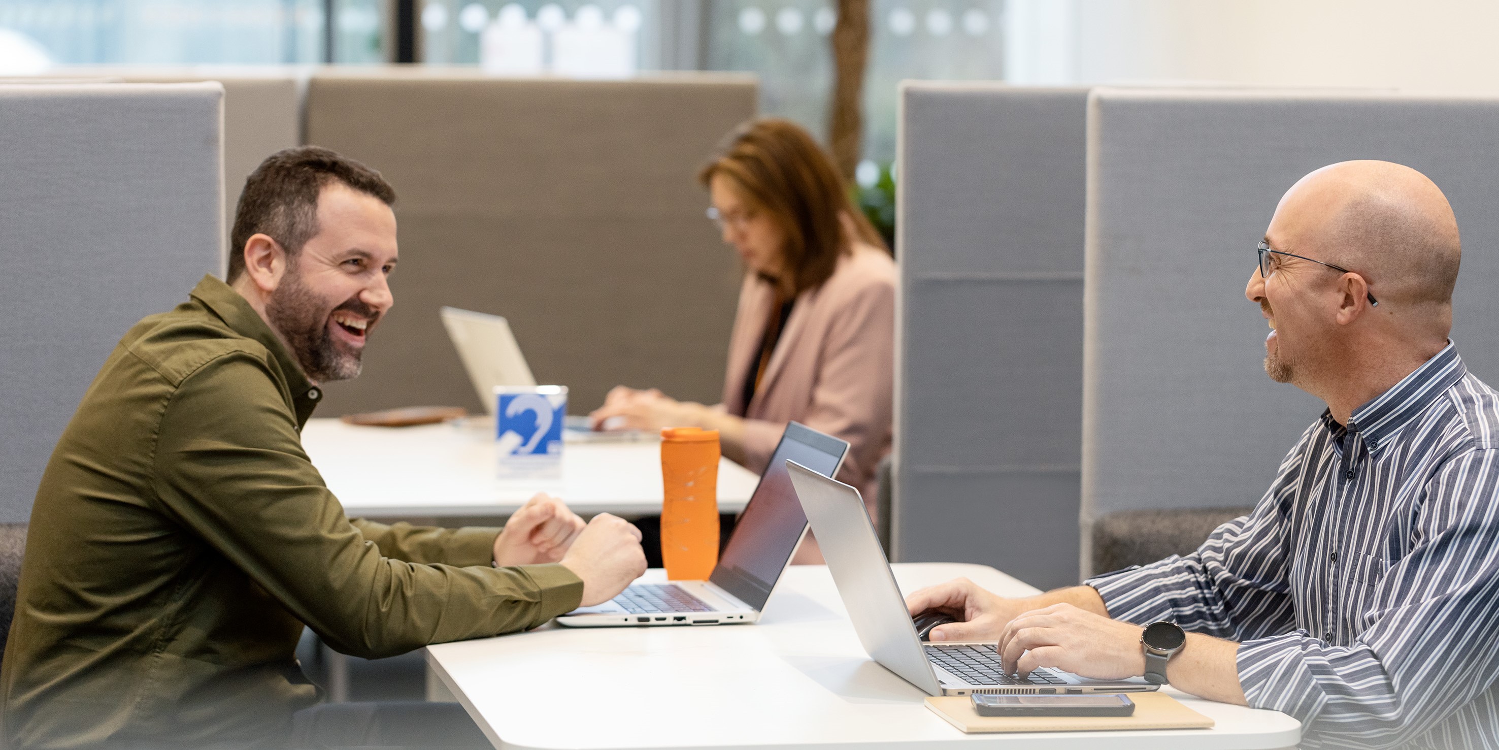 laughing coworkers in an office setting