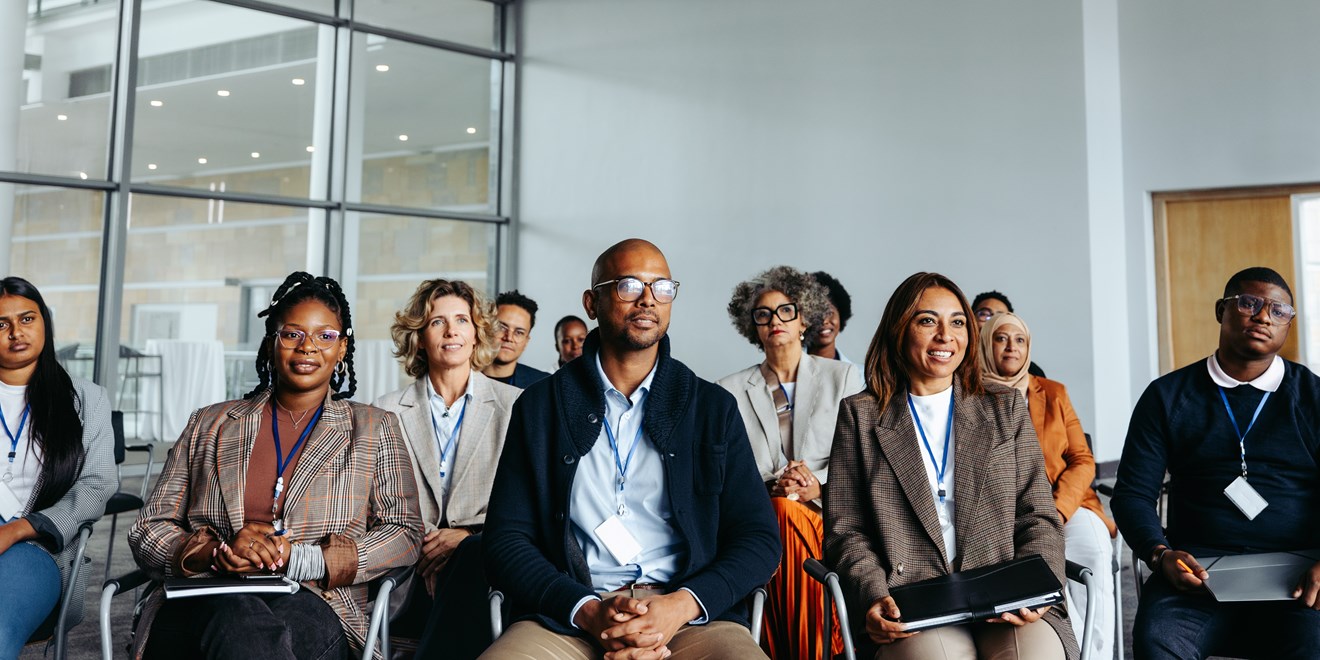diverse mix of adults office setting 30-40yrs